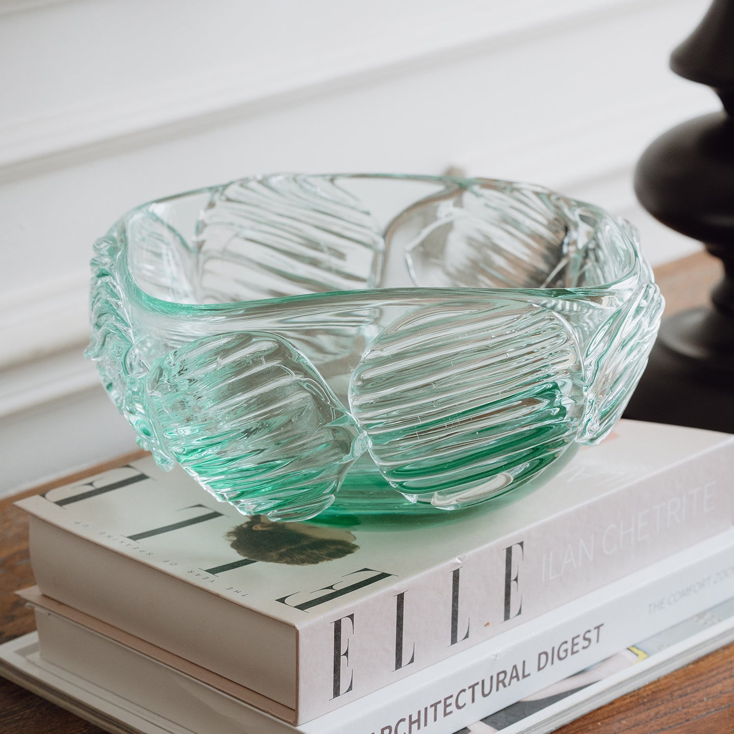 Textured clear blue decorative glass bowl inspired by glacial ice with a sculptural design for modern luxury interiors.