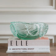 Textured clear blue decorative glass bowl inspired by glacial ice with a sculptural design for modern luxury interiors.
