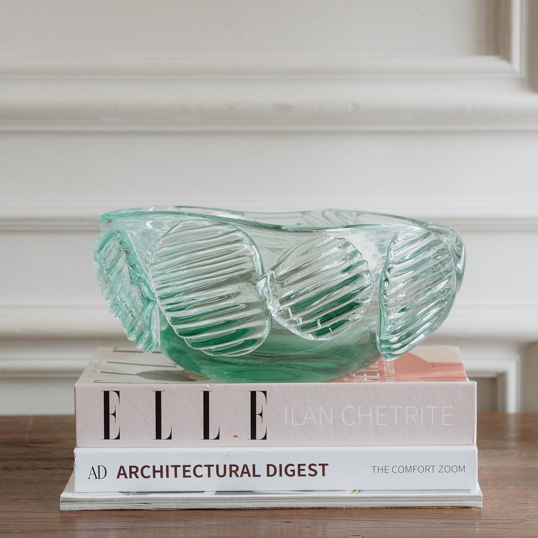 Textured clear blue decorative glass bowl inspired by glacial ice with a sculptural design for modern luxury interiors.