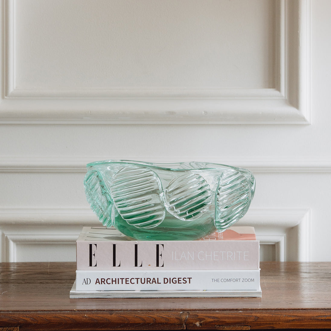 Textured clear blue decorative glass bowl inspired by glacial ice with a sculptural design for modern luxury interiors.