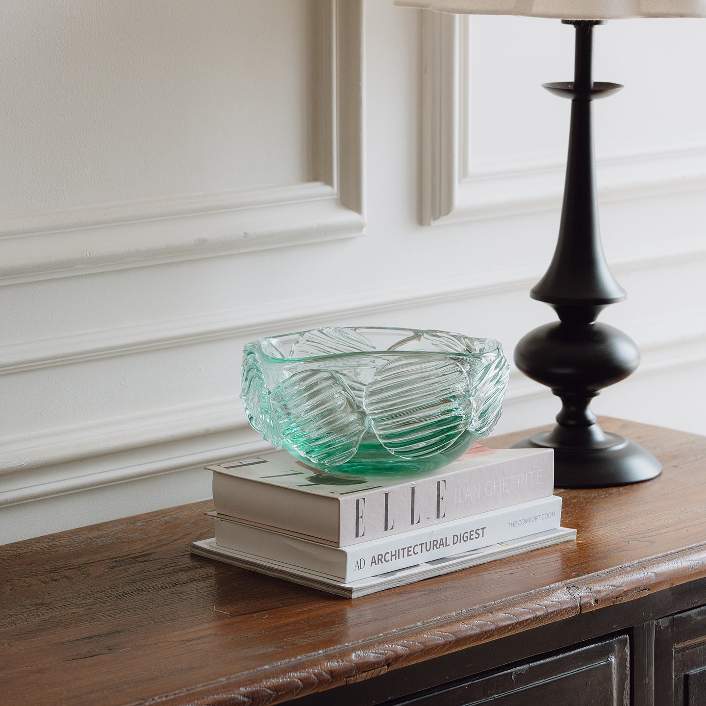 Textured clear blue decorative glass bowl inspired by glacial ice with a sculptural design for modern luxury interiors.