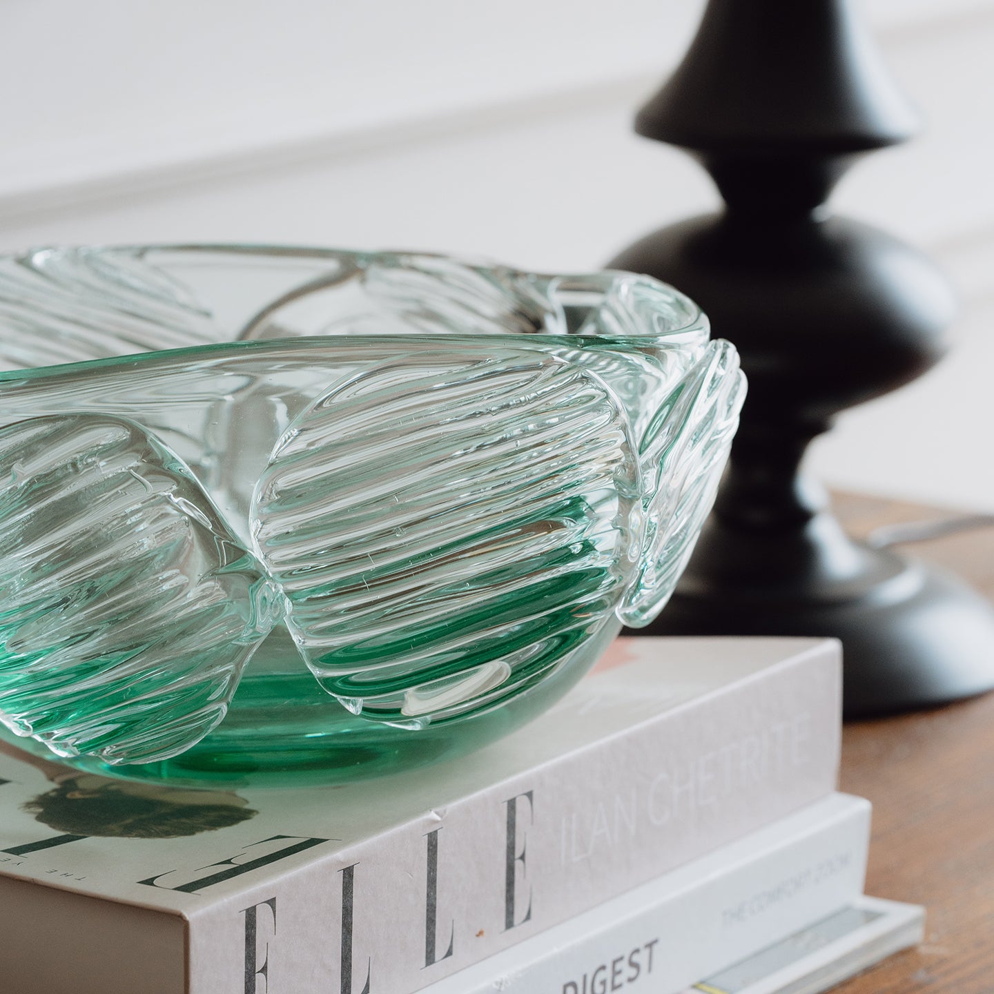 Textured clear blue decorative glass bowl inspired by glacial ice with a sculptural design for modern luxury interiors.