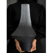 Decorative glass vase with a grey ombre finish and sculptural organic silhouette for contemporary and luxury interiors.