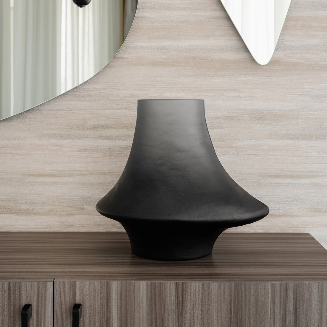 Decorative glass vase with a grey ombre finish and sculptural organic silhouette for contemporary and luxury interiors.