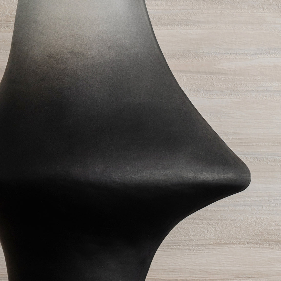 Decorative glass vase with a grey ombre finish and sculptural organic silhouette for contemporary and luxury interiors.