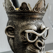 Chill Chimp silver ice bucket with sculptural monkey design, luxury home bar accessory for entertaining and modern home décor.