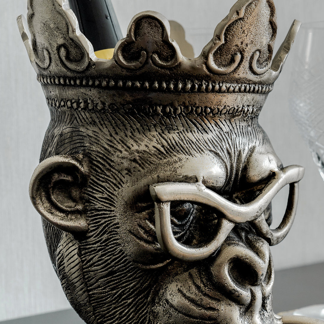 Chill Chimp silver ice bucket with sculptural monkey design, luxury home bar accessory for entertaining and modern home décor.
