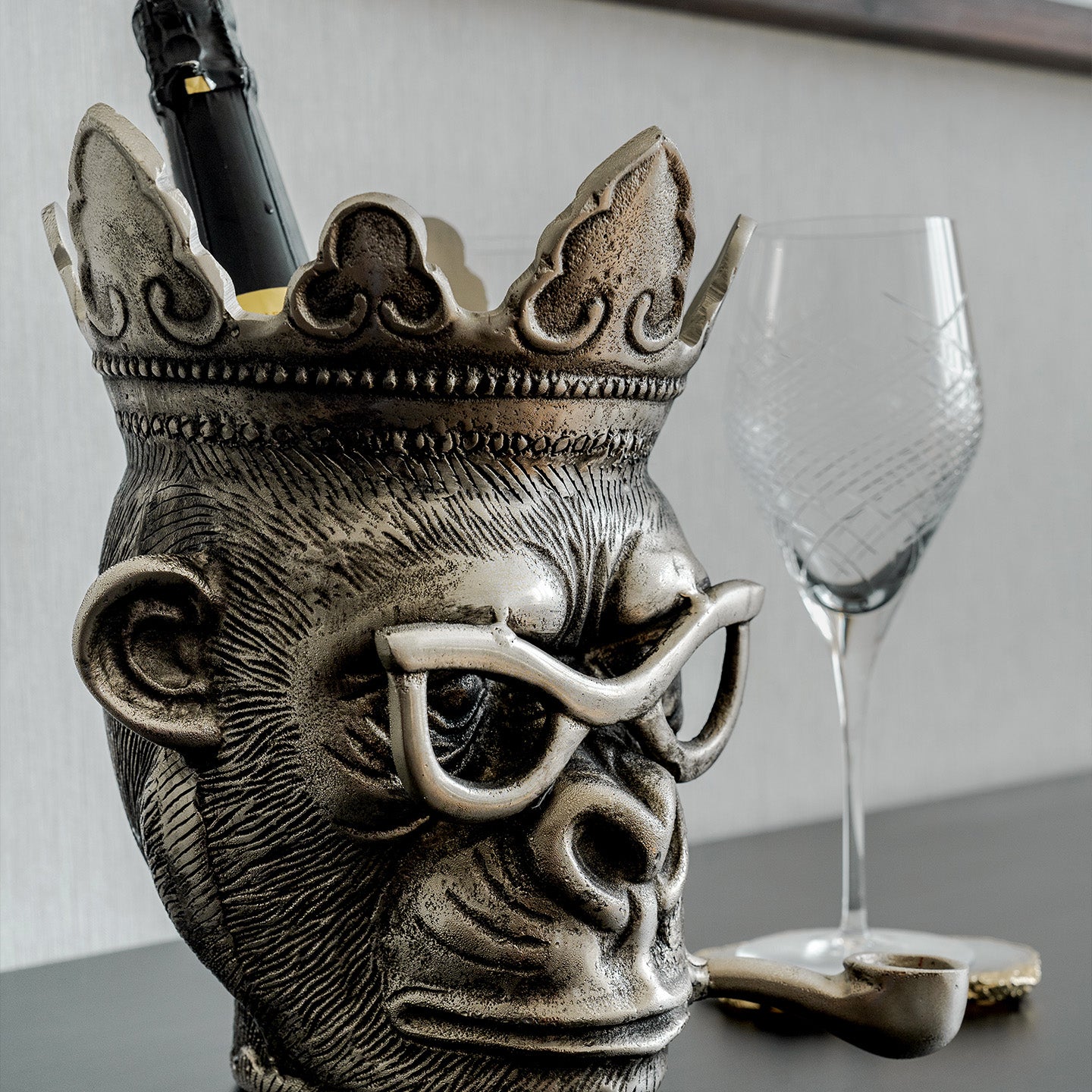 Chill Chimp silver ice bucket with sculptural monkey design, luxury home bar accessory for entertaining and modern home décor.