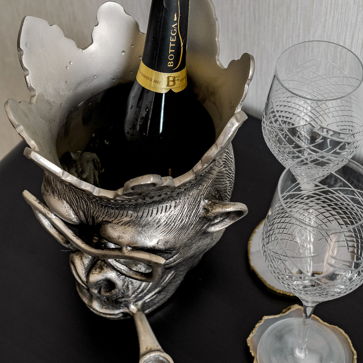 Chill Chimp silver ice bucket with sculptural monkey design, luxury home bar accessory for entertaining and modern home décor.