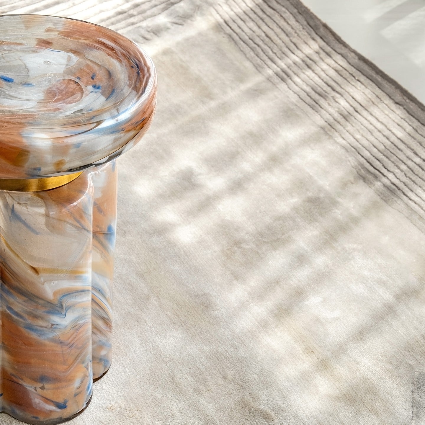 Clover swirl accent table with clover-shaped base and pastel tones, luxury designer side table for modern home décor