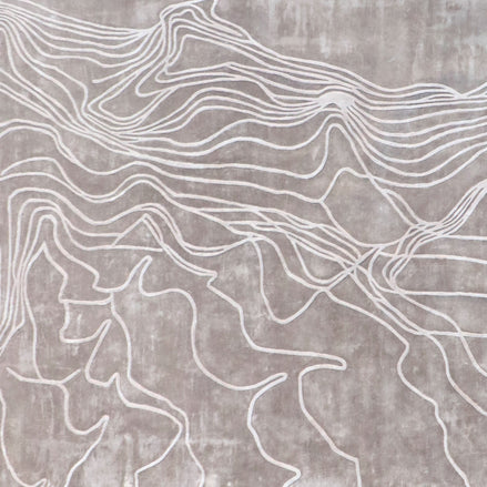 Handmade textured rug with sculpted high-pile waves in an organic pattern for contemporary and luxury interiors.