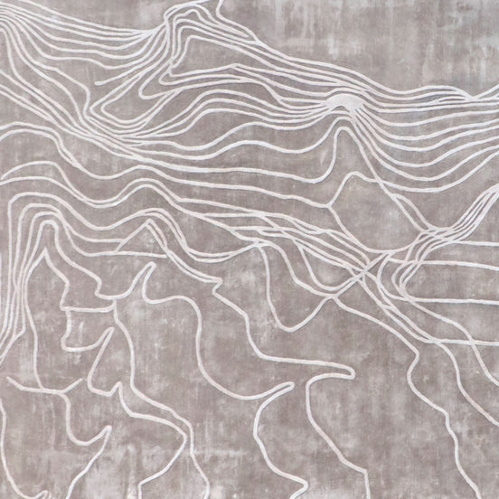 Handmade textured rug with sculpted high-pile waves in an organic pattern for contemporary and luxury interiors.