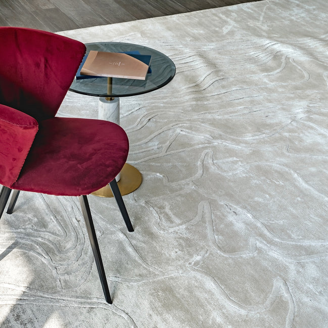 Handmade textured rug with sculpted high-pile waves in an organic pattern for contemporary and luxury interiors.