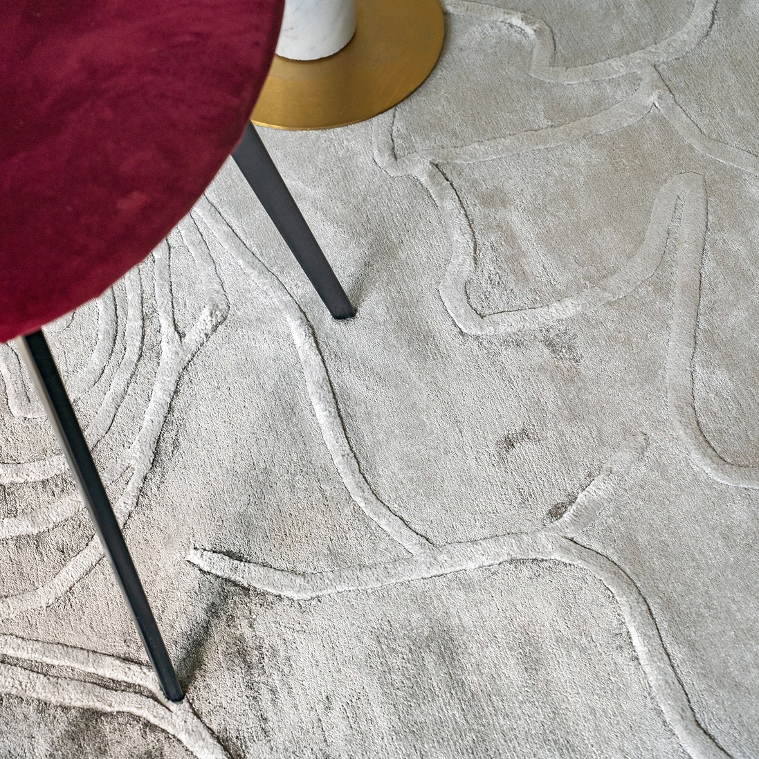 Handmade textured rug with sculpted high-pile waves in an organic pattern for contemporary and luxury interiors.