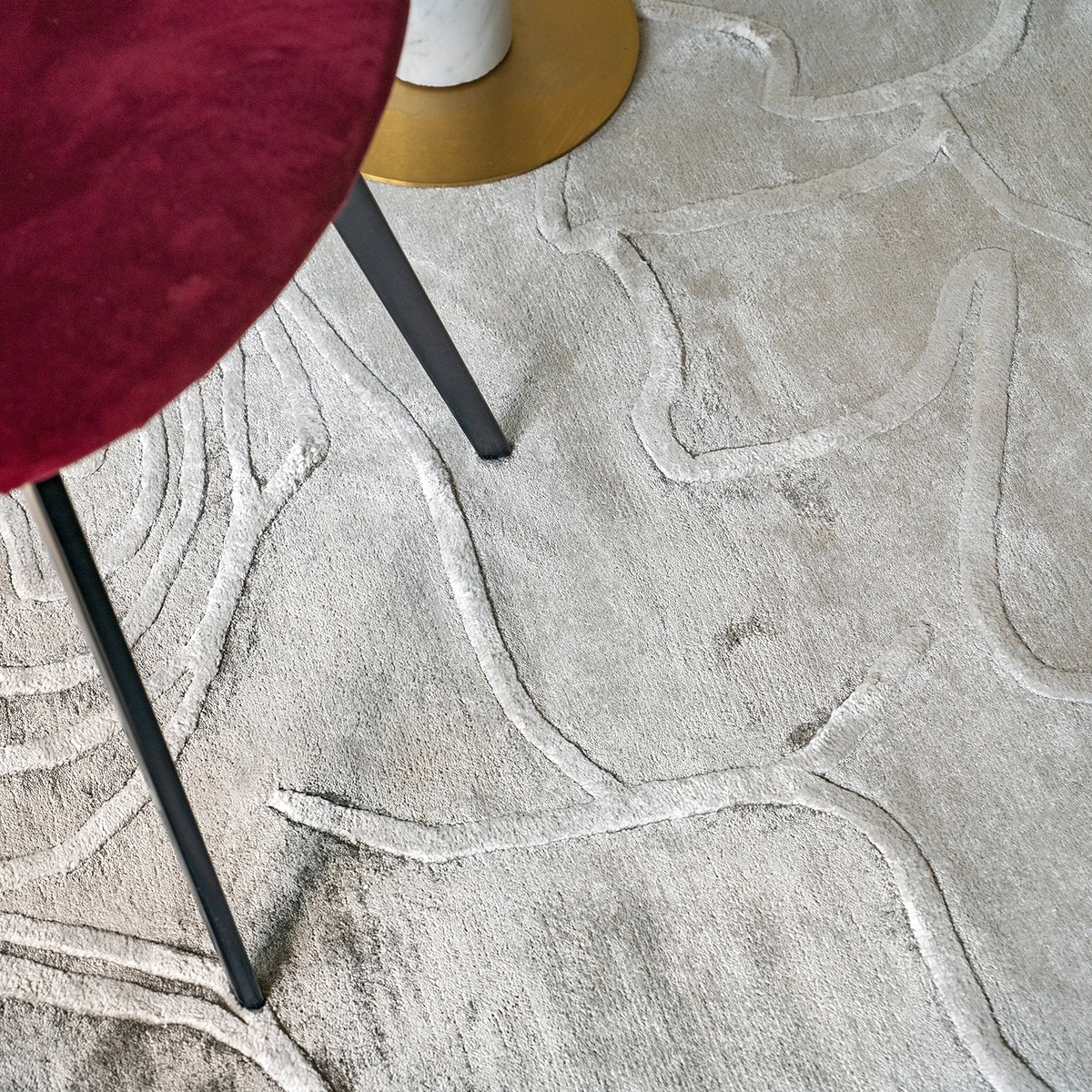 Handmade textured rug with sculpted high-pile waves in an organic pattern for contemporary and luxury interiors.