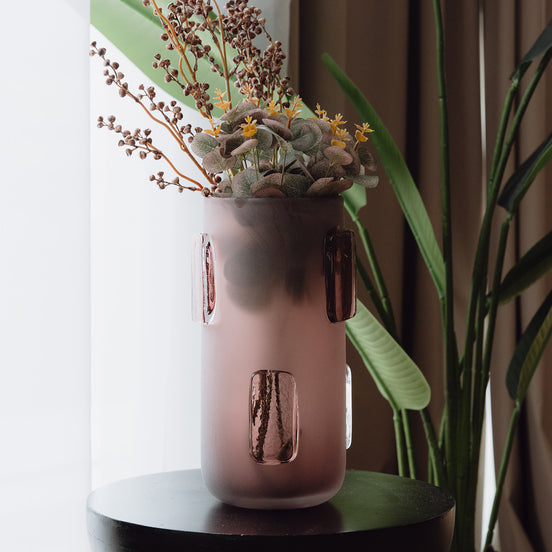 Frosted deep red decorative glass vase with a sleek cylindrical silhouette and glossy accents for contemporary luxury interiors.