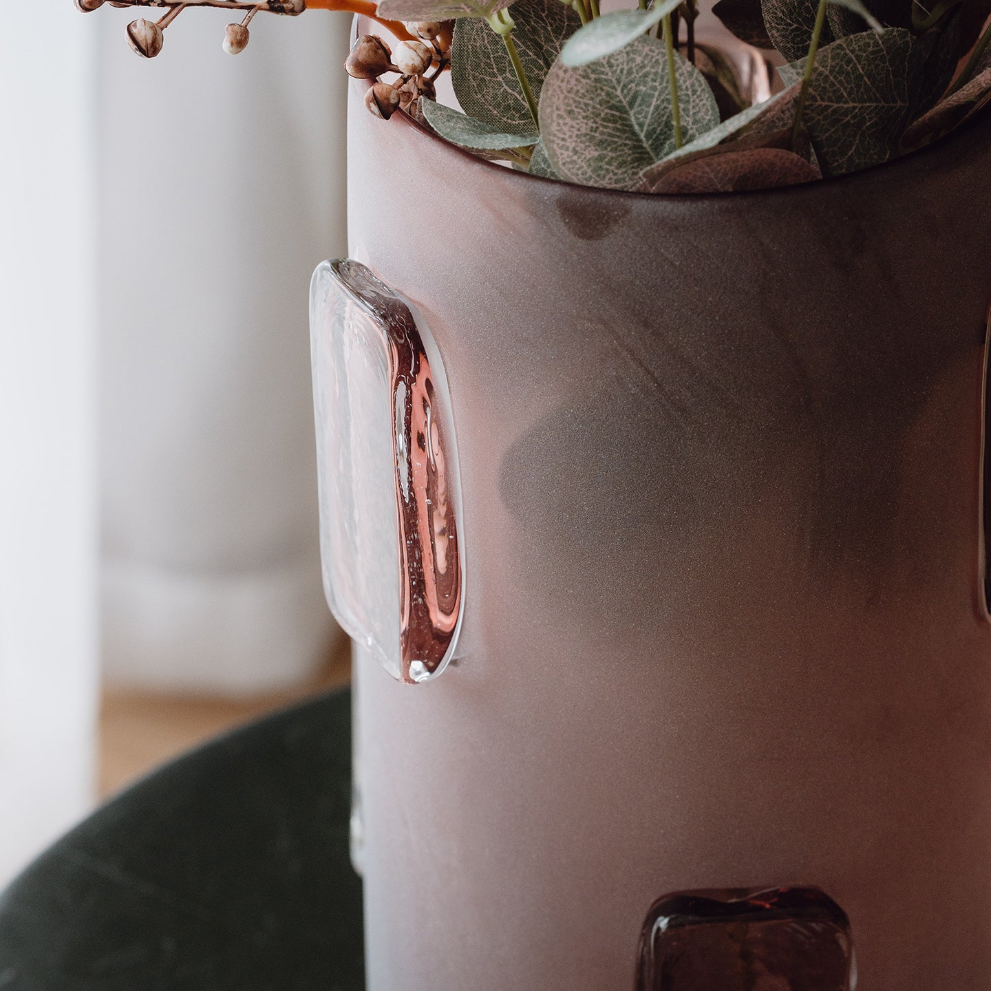 Frosted deep red decorative glass vase with a sleek cylindrical silhouette and glossy accents for contemporary luxury interiors.