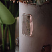Frosted deep red decorative glass vase with a sleek cylindrical silhouette and glossy accents for contemporary luxury interiors.