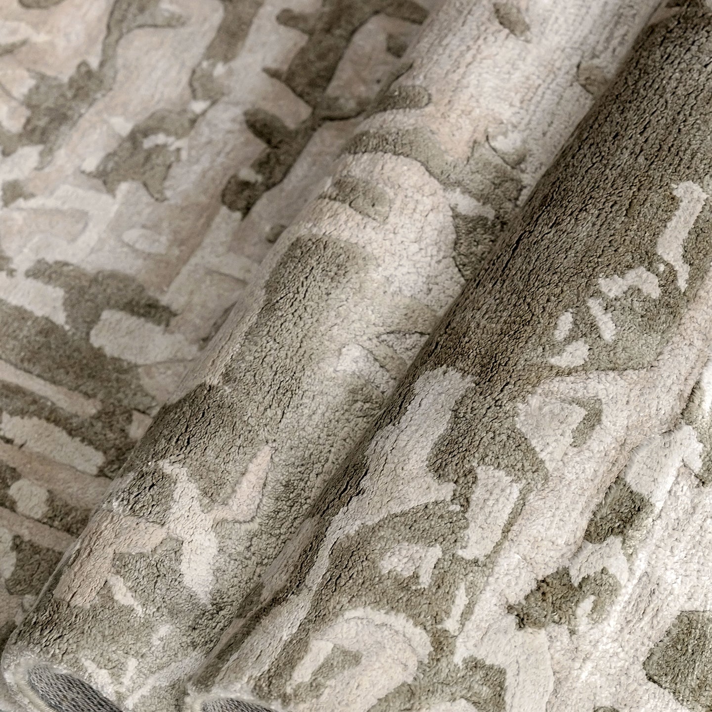 Handmade bamboo silk rug with an abstract design in warm beige and cream tones for contemporary and luxury interiors.