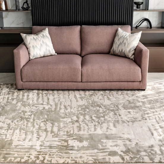 Handmade bamboo silk rug with an abstract design in warm beige and cream tones for contemporary and luxury interiors.