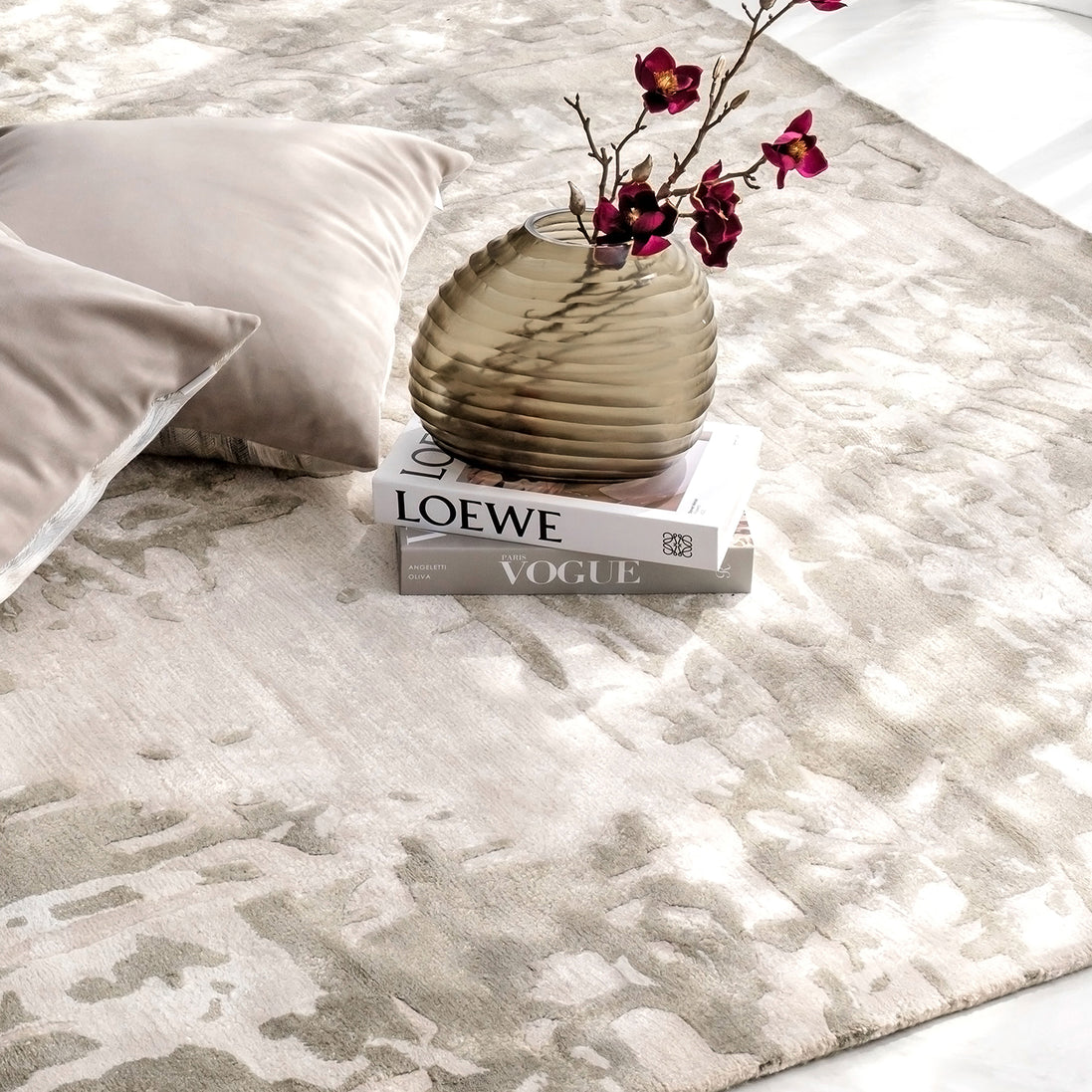 Handmade bamboo silk rug with an abstract design in warm beige and cream tones for contemporary and luxury interiors.