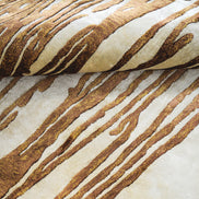Handmade abstract rug with deep rust tones and a cream base, designed for modern and transitional luxury interiors.