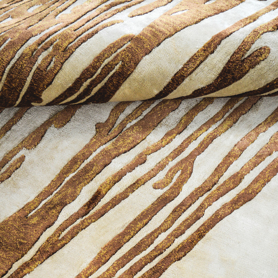Handmade abstract rug with deep rust tones and a cream base, designed for modern and transitional luxury interiors.