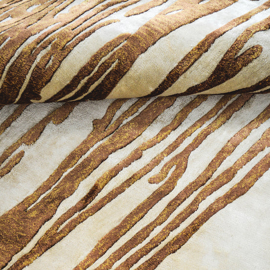 Handmade abstract rug with deep rust tones and a cream base, designed for modern and transitional luxury interiors.