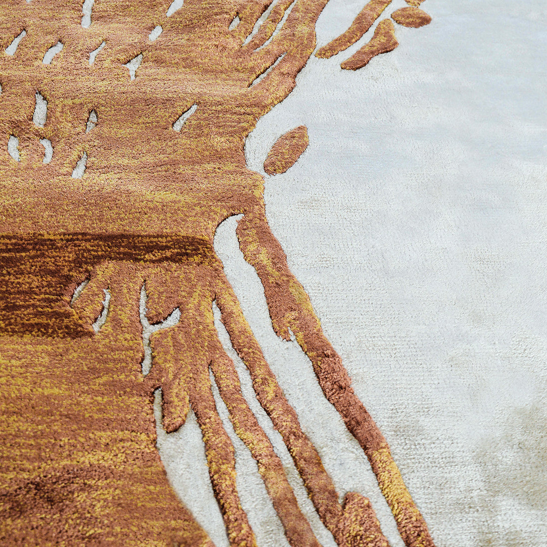 Handmade abstract rug with deep rust tones and a cream base, designed for modern and transitional luxury interiors.