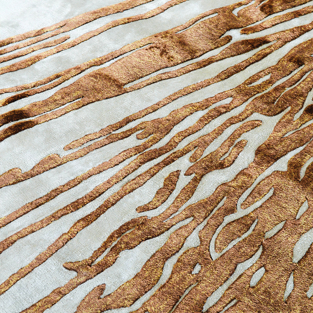 Handmade abstract rug with deep rust tones and a cream base, designed for modern and transitional luxury interiors.