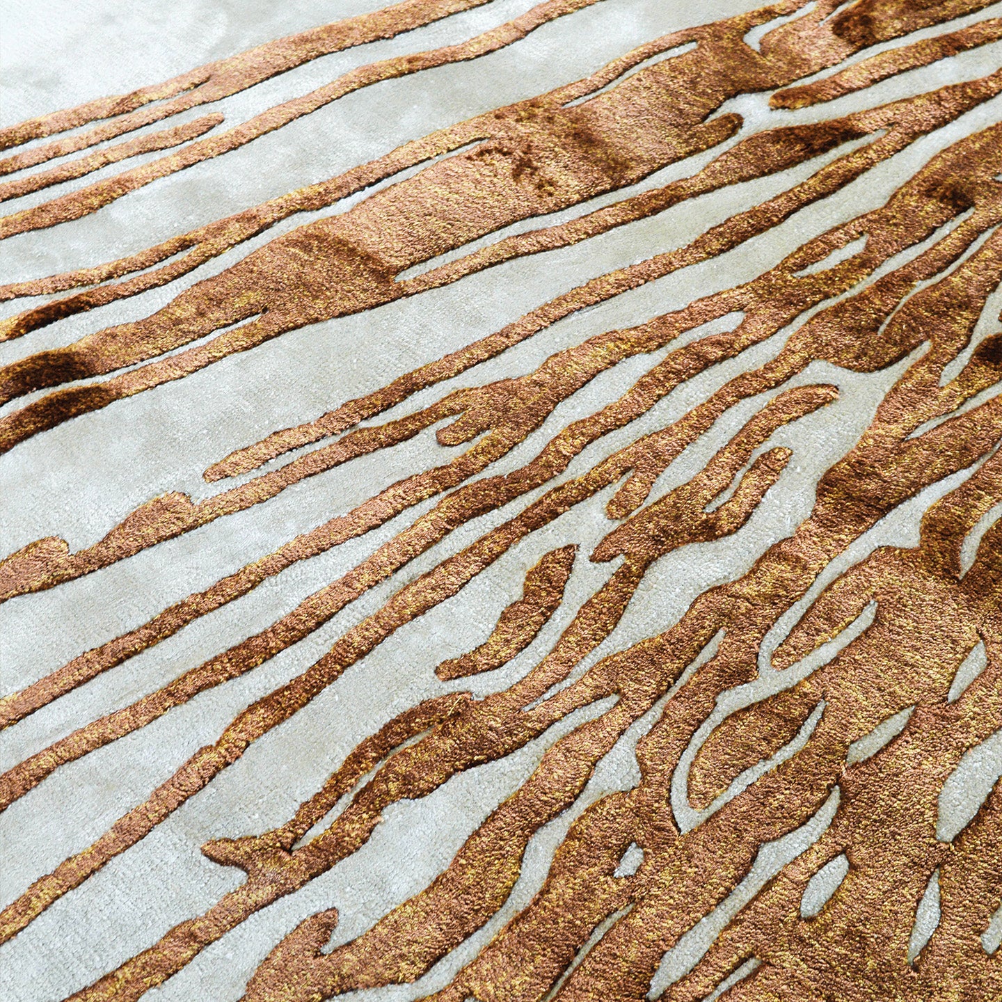 Handmade abstract rug with deep rust tones and a cream base, designed for modern and transitional luxury interiors.