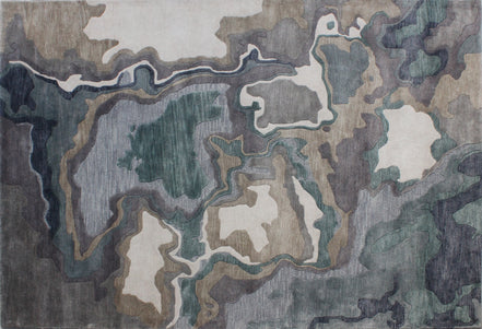 Handmade bamboo silk rug with textured organic motifs in soft blue, deep green, and neutral tones inspired by flowing water.