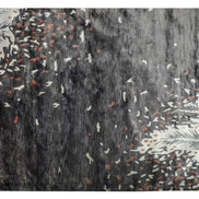 Handmade botanical rug inspired by UAE palm leaves with delicate leaf motifs fading into soft scattered flecks of colour.