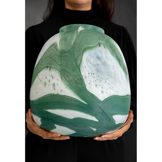 Iris abstract glass vase with rounded shape and green brushstroke pattern on white background, decorative vase for modern home décor