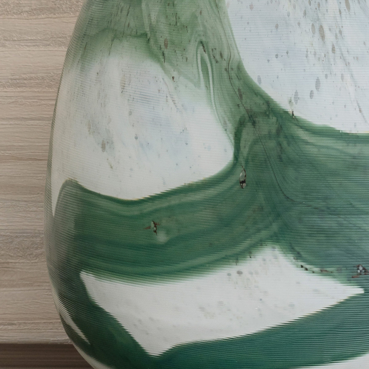 Iris abstract glass vase with rounded shape and green brushstroke pattern on white background, decorative vase for modern home décor