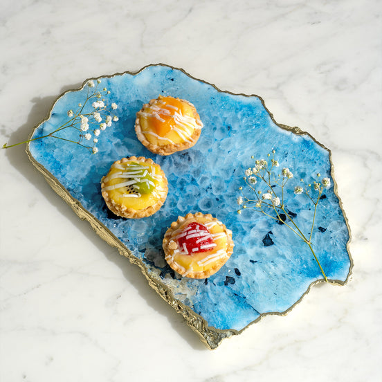 Kristal blue agate stone platter with organic shape and light gold edge, luxury natural stone serving platter for elegant entertaining and décor