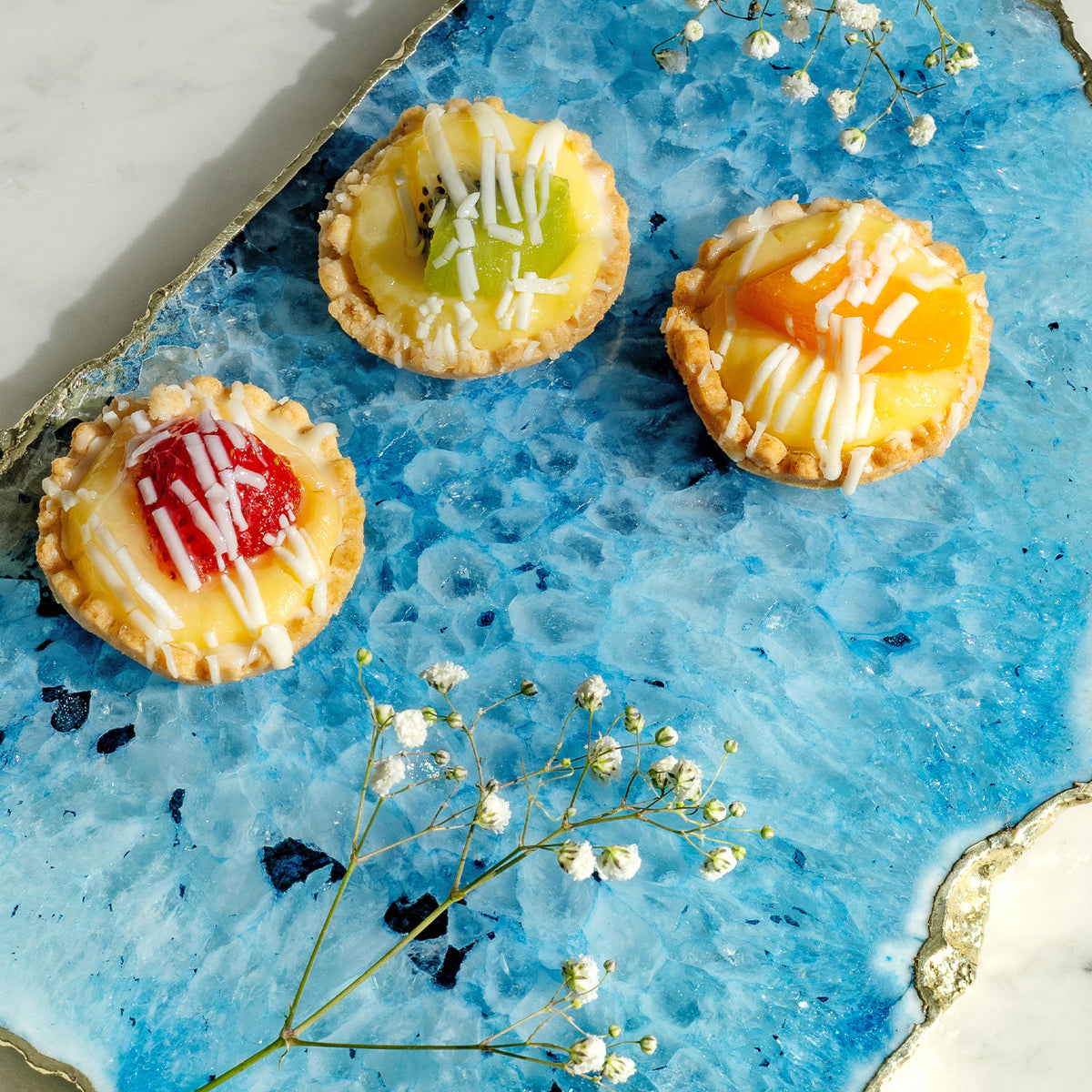 Kristal blue agate stone platter with organic shape and light gold edge, luxury natural stone serving platter for elegant entertaining and décor