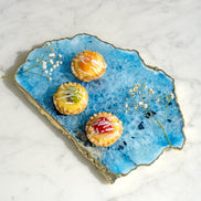 Kristal blue agate stone platter with organic shape and light gold edge, luxury natural stone serving platter for elegant entertaining and décor