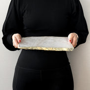 Kristal rose quartz stone platter with organic shape and gold edge, luxury serving platter for elegant home décor and entertaining.