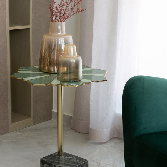 Lotus handcrafted metal side table with enamel finish and grey marble base, sculptural accent table for modern home décor
