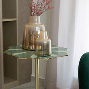 Lotus handcrafted metal side table with enamel finish and grey marble base, sculptural accent table for modern home décor