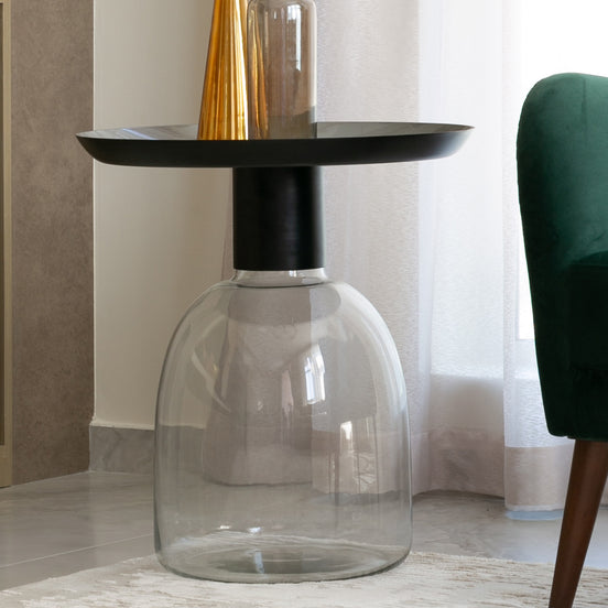 Luxe black and grey glass accent table with handblown glass base and matte black metal finish, modern side table for home décor