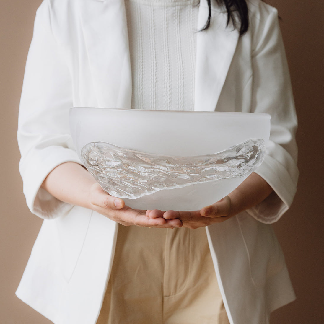 Decorative glass bowl with a frosted white base and textured clear finish inspired by quartz crystal for modern luxury interiors.