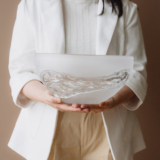 Decorative glass bowl with a frosted white base and textured clear finish inspired by quartz crystal for modern luxury interiors.