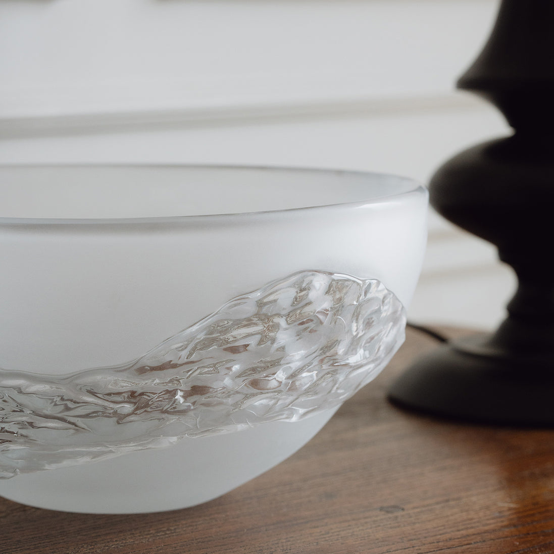 Decorative glass bowl with a frosted white base and textured clear finish inspired by quartz crystal for modern luxury interiors.