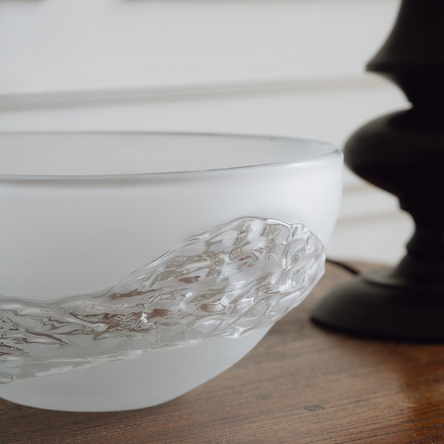 Decorative glass bowl with a frosted white base and textured clear finish inspired by quartz crystal for modern luxury interiors.