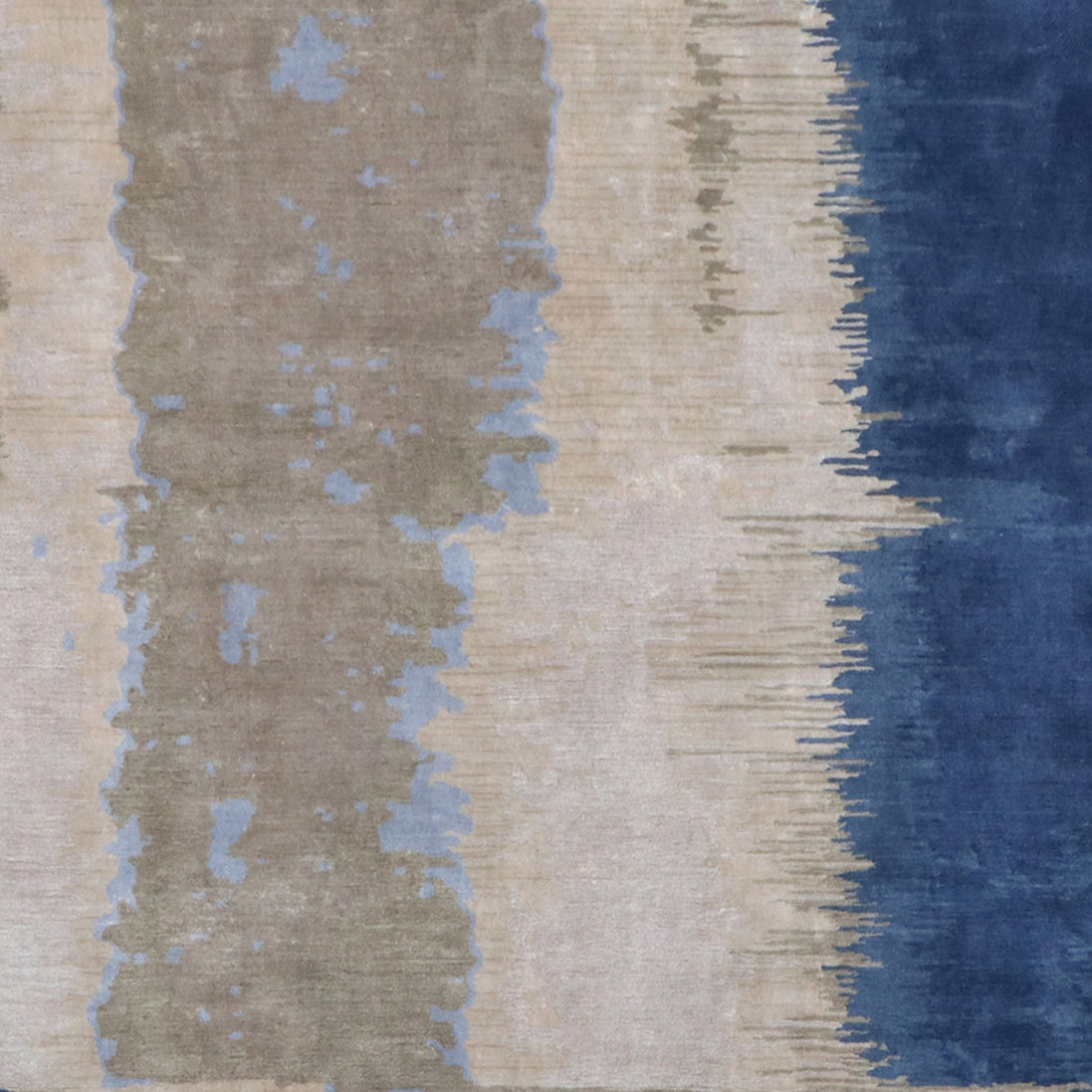 Handmade bamboo silk rug with layered blue tones inspired by the Greek island of Santorini and Mediterranean coastal landscapes.