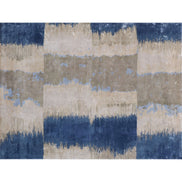 Handmade bamboo silk rug with layered blue tones inspired by the Greek island of Santorini and Mediterranean coastal landscapes.