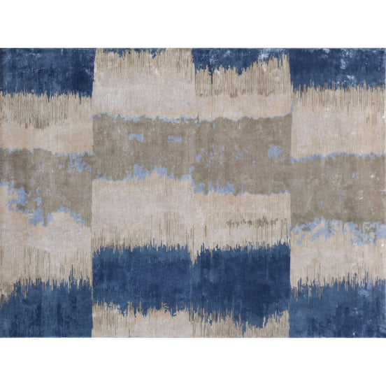 Handmade bamboo silk rug with layered blue tones inspired by the Greek island of Santorini and Mediterranean coastal landscapes.