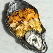 Seashell silver decorative platter with intricate shell design, coastal-inspired luxury home décor accent.